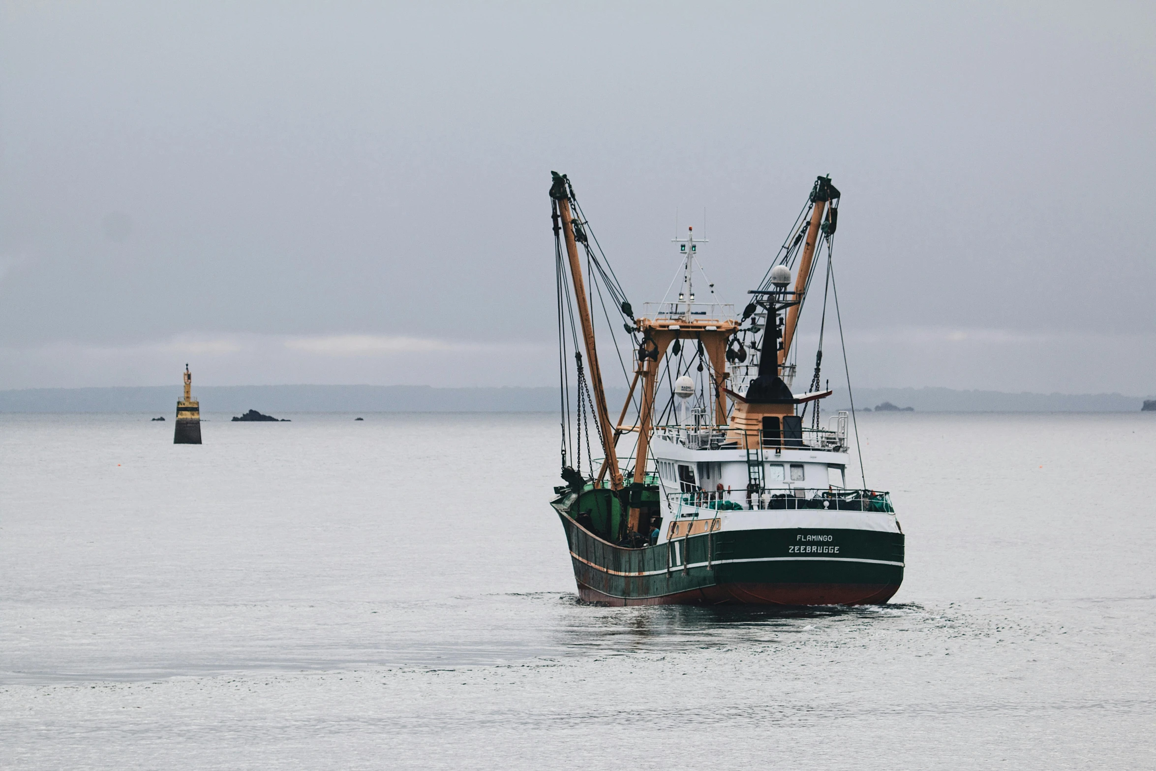 a large fishing boat in a body of water