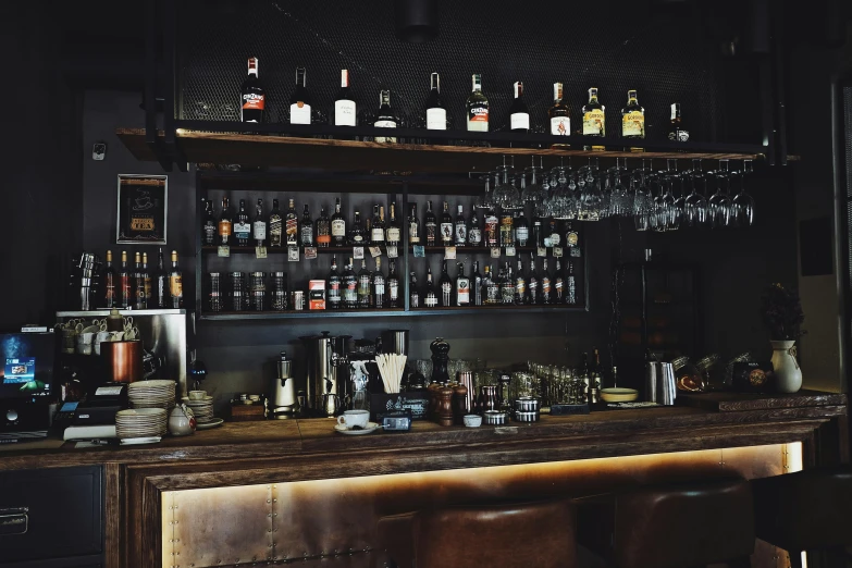 a group of bottles of liquor and drinks on a shelf