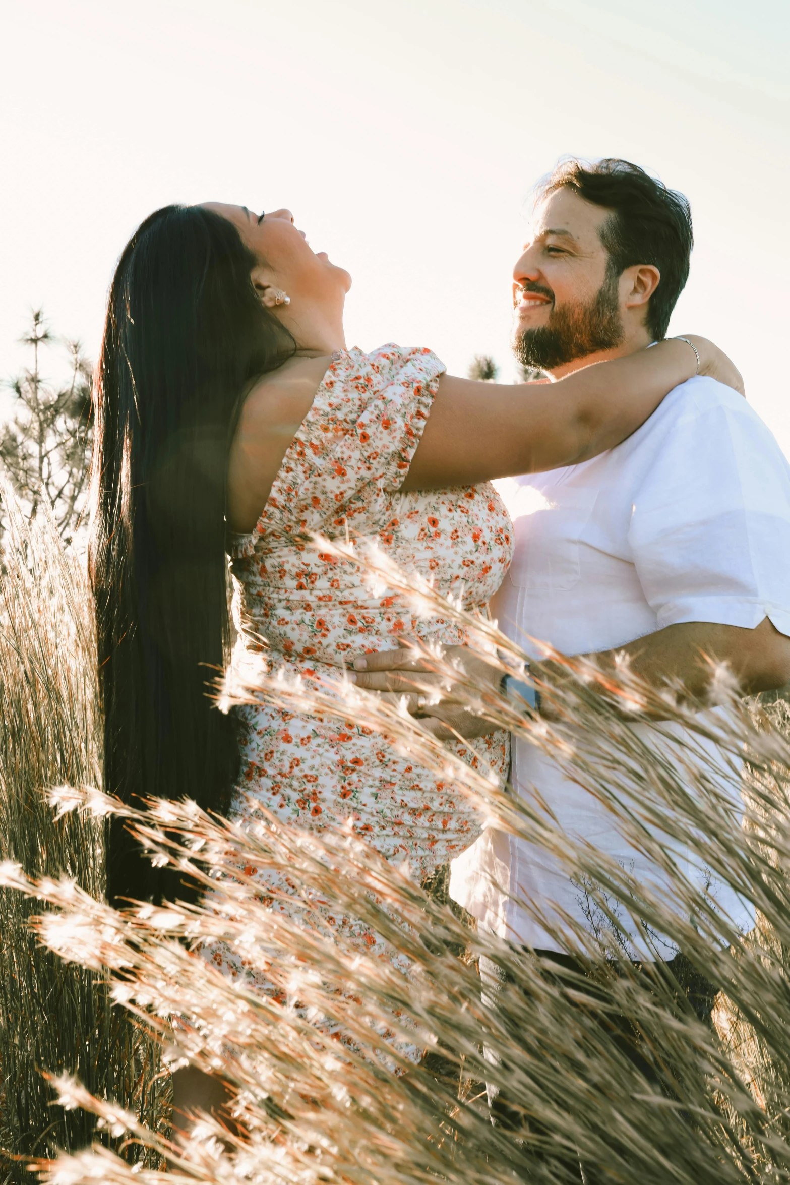 there are a couple hugging and smiling together