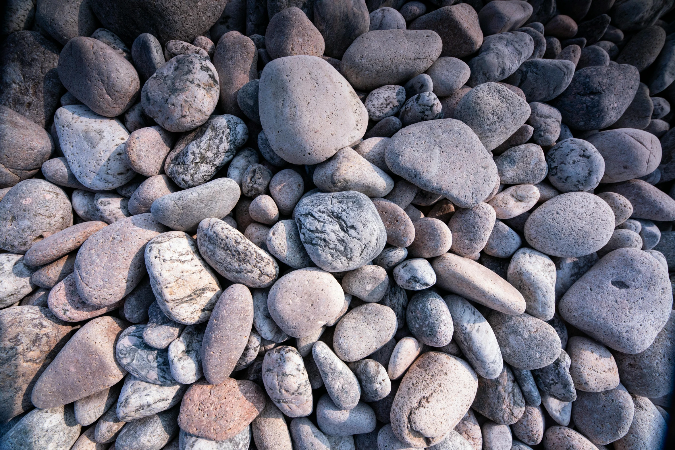 a close up view of large rocks with one in the middle