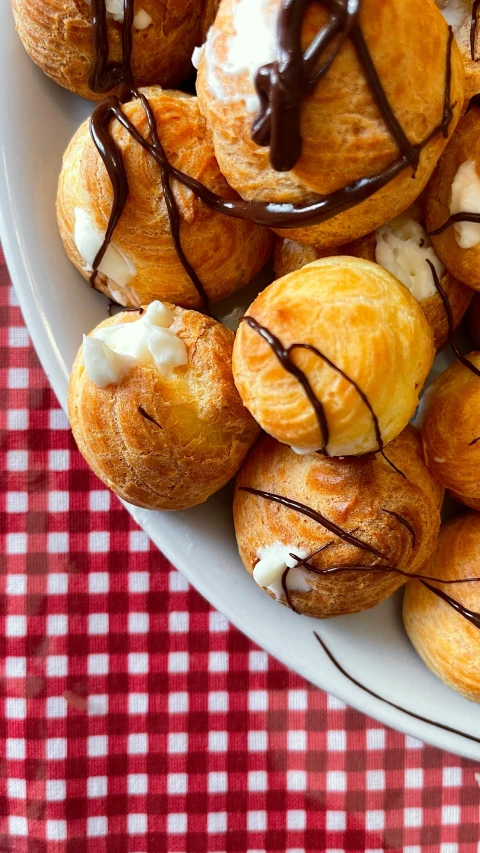 the pastries are arranged nicely in a dish on the table