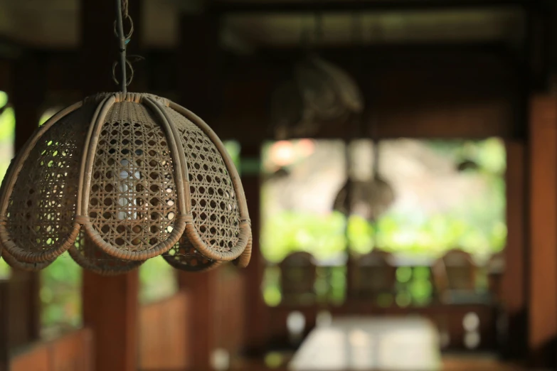 hanging lights with different designs and shapes hanging on the ceiling