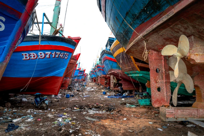 multiple large ships that are docked in a dry dock