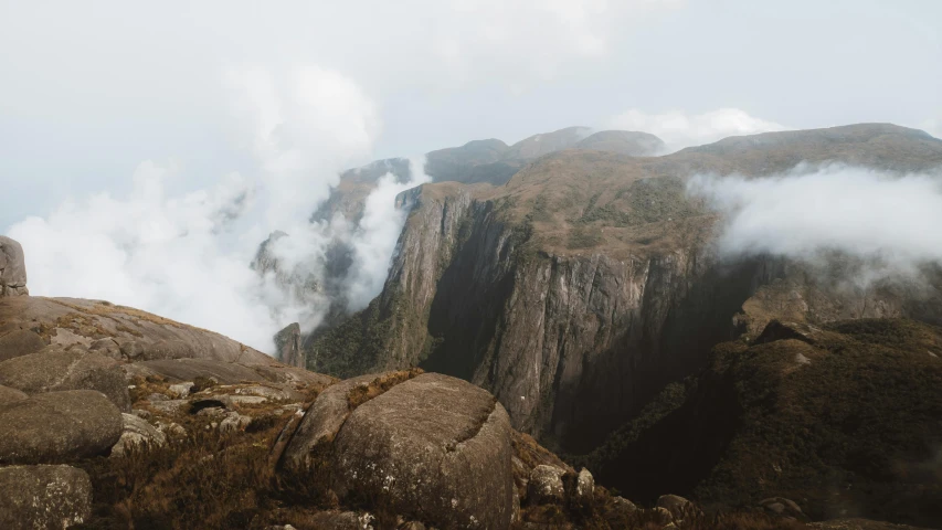 thick clouds are floating in the mountain range