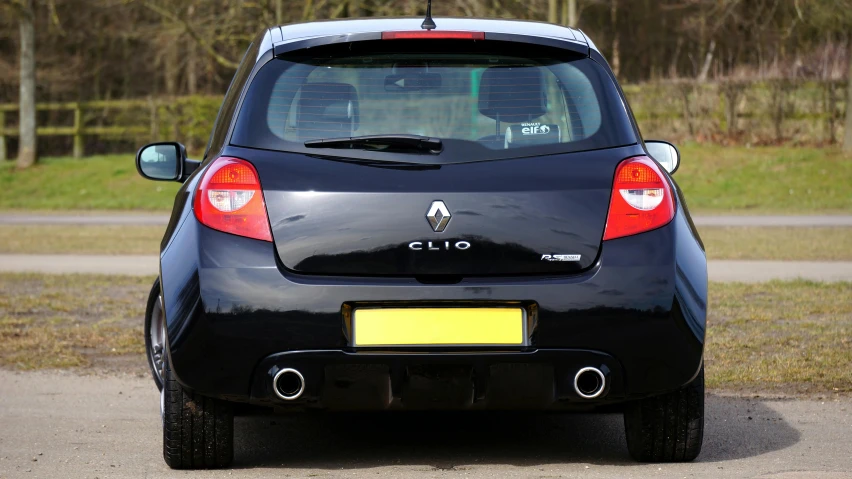 the back end of a small car on a road