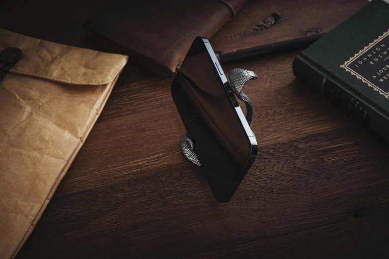 wallet and papers on a table with a binder