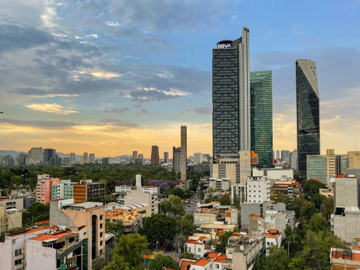 some buildings are shown under a cloudy sky