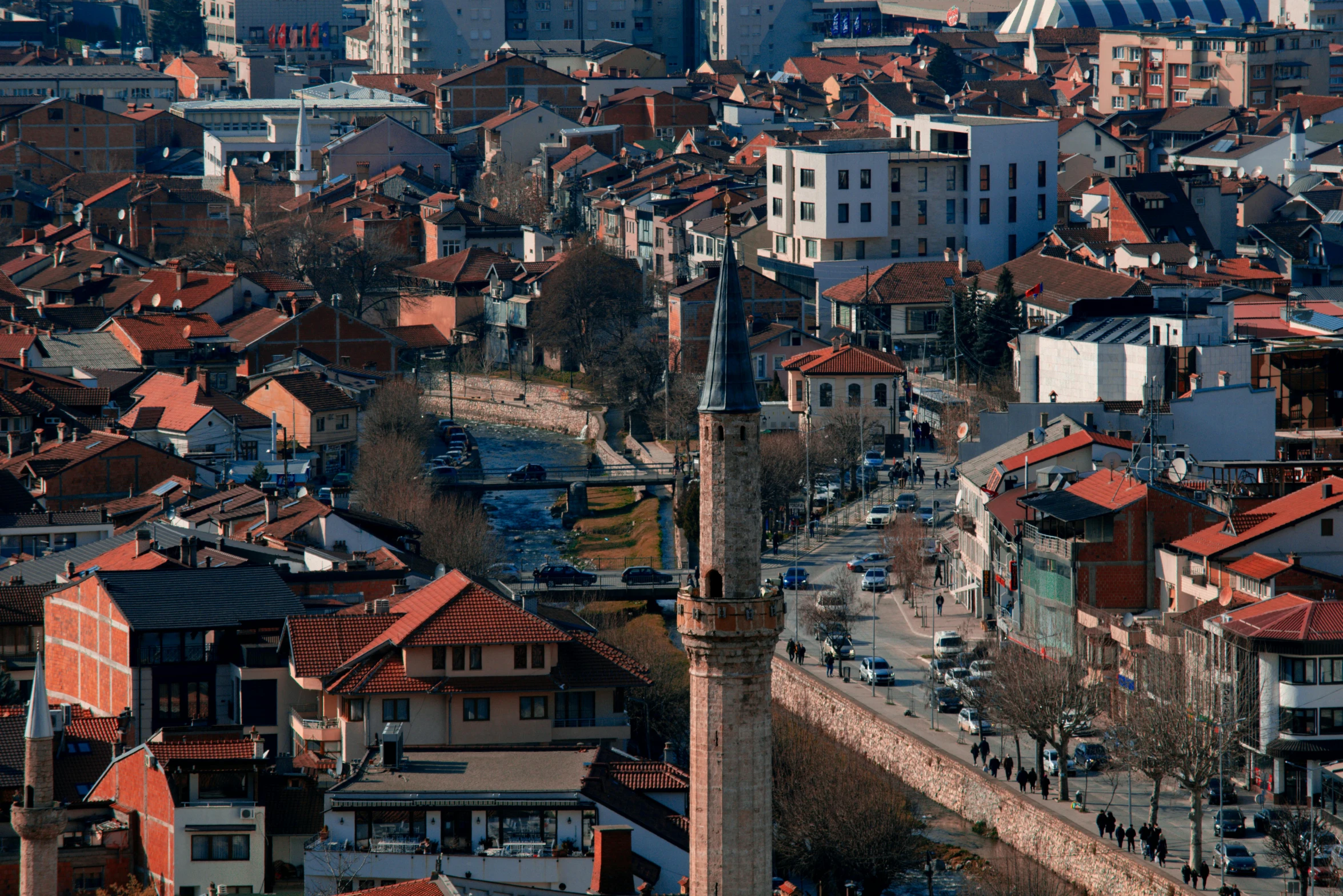 an aerial view of a city and a tall clock tower