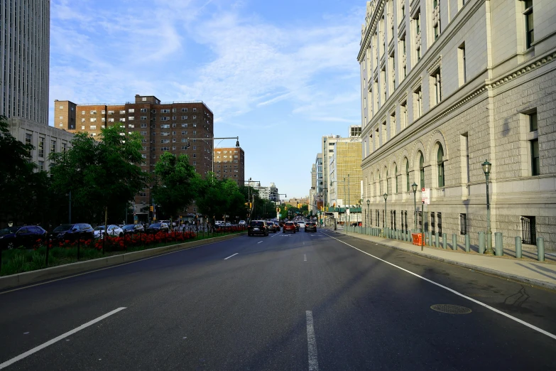 a long empty road with buildings on both sides