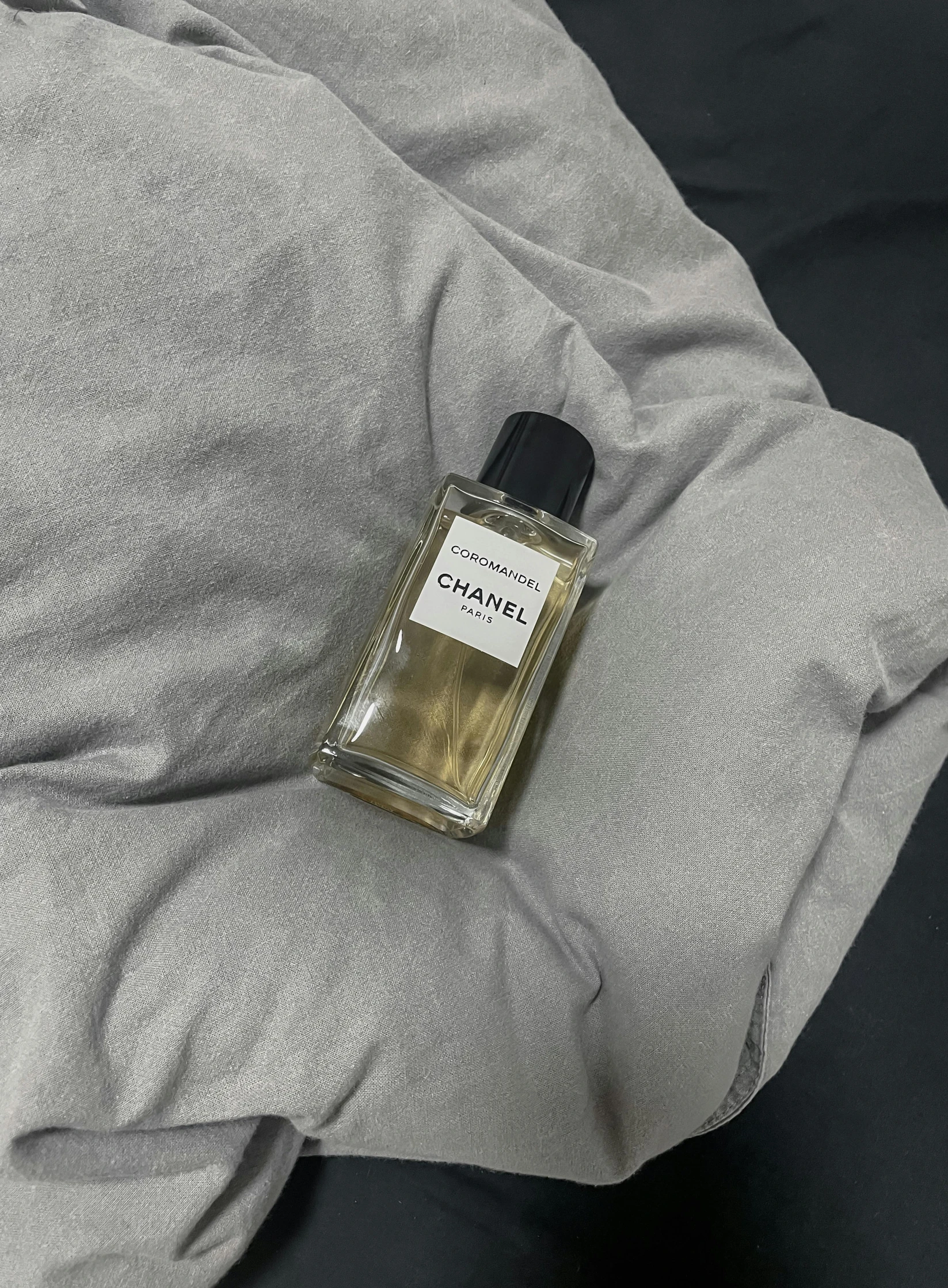a bottle that is sitting on the pillow