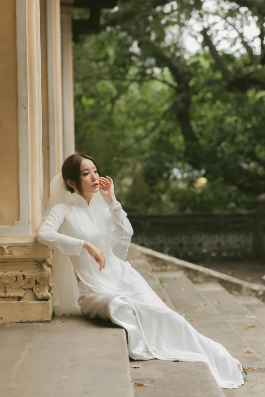 a woman in a dress poses for a po