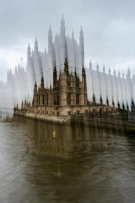 a long - s view of some building in a body of water