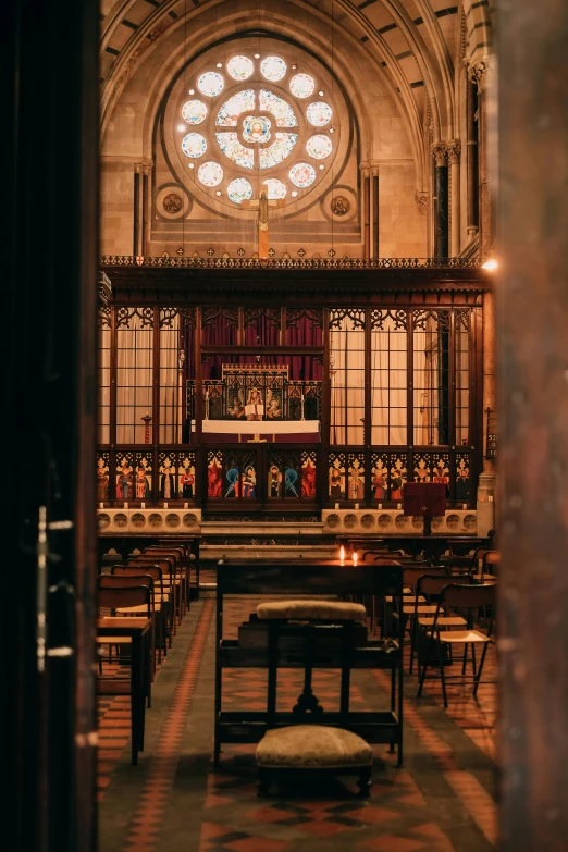 an alter of a church with several benches in front