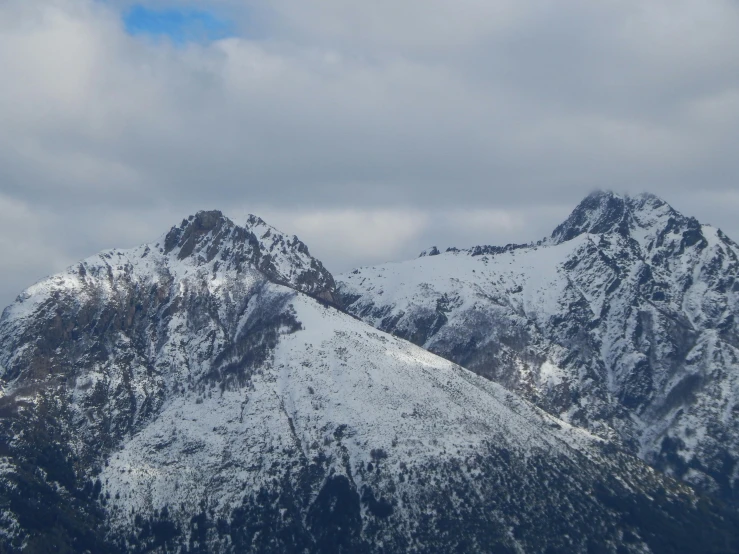 the snowy mountains are towering in the sky