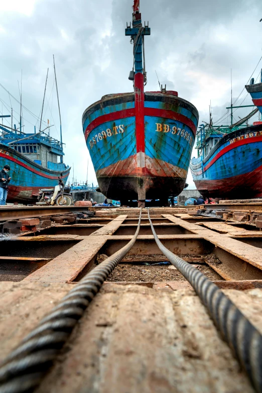 a couple of large blue and red boats docked