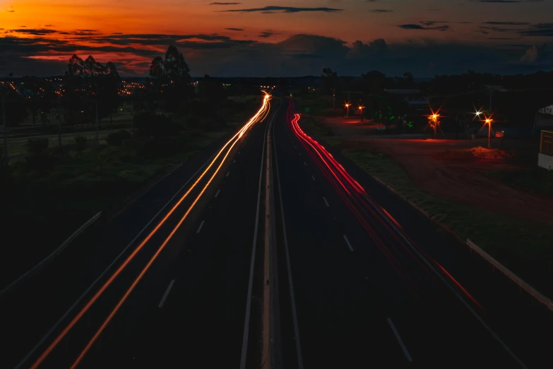 a group of buildings and traffic on a road