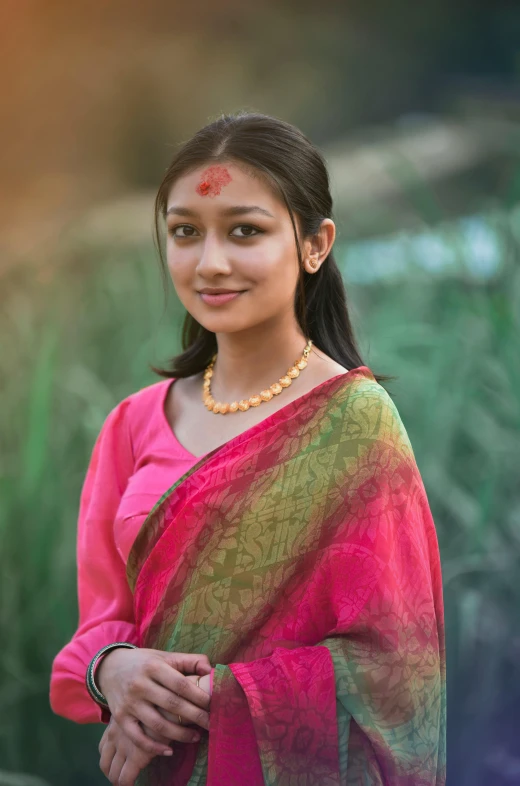 the woman is wearing a colorful sari