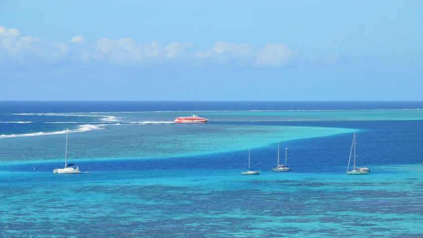 boats and water craft moving through the sea off the coast