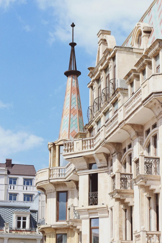 an ornate building with two clock towers, next to a very big building