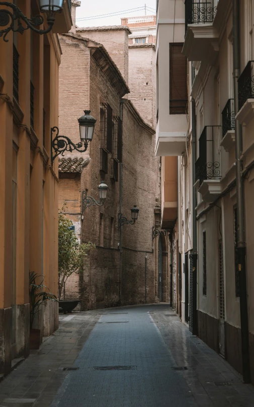 an empty street with two tall buildings