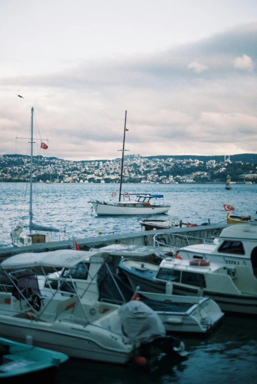 a bunch of small boats in a harbor