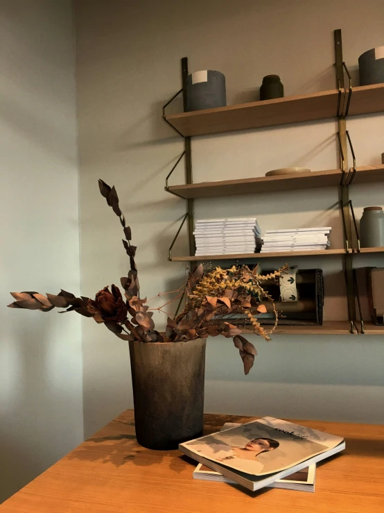 a vase filled with flowers on top of a table