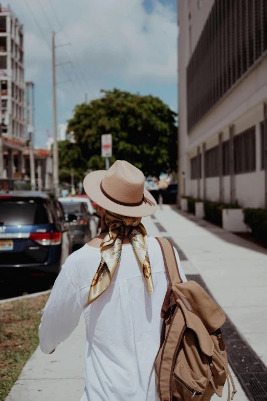 person walking down a street in an unkempt city