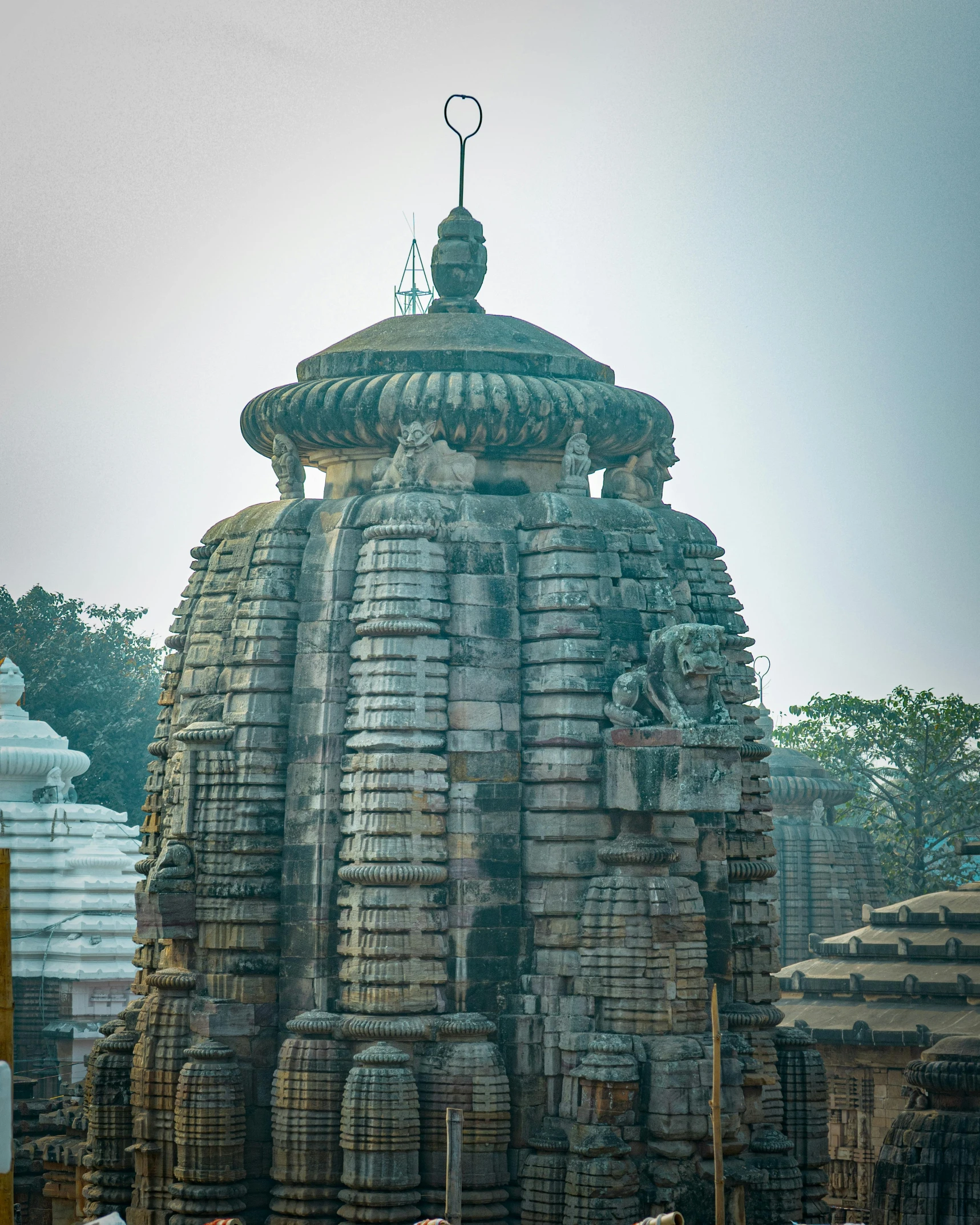 an indian temple made out of rocks and water features