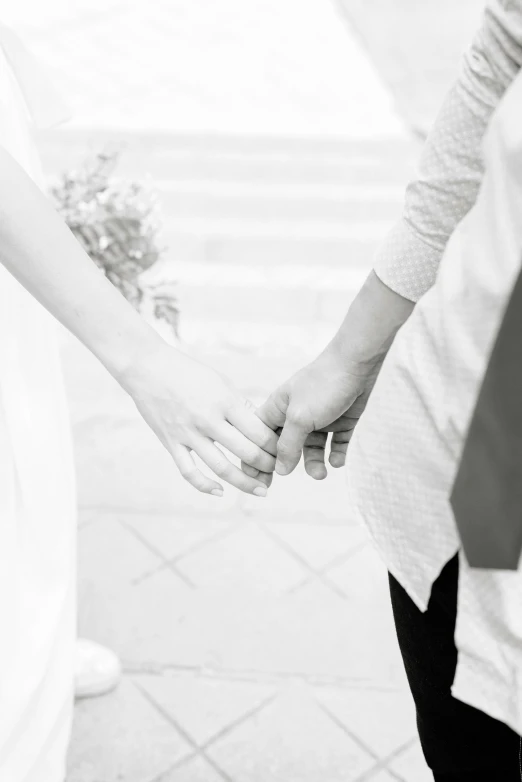 an up close view of a couple holding hands