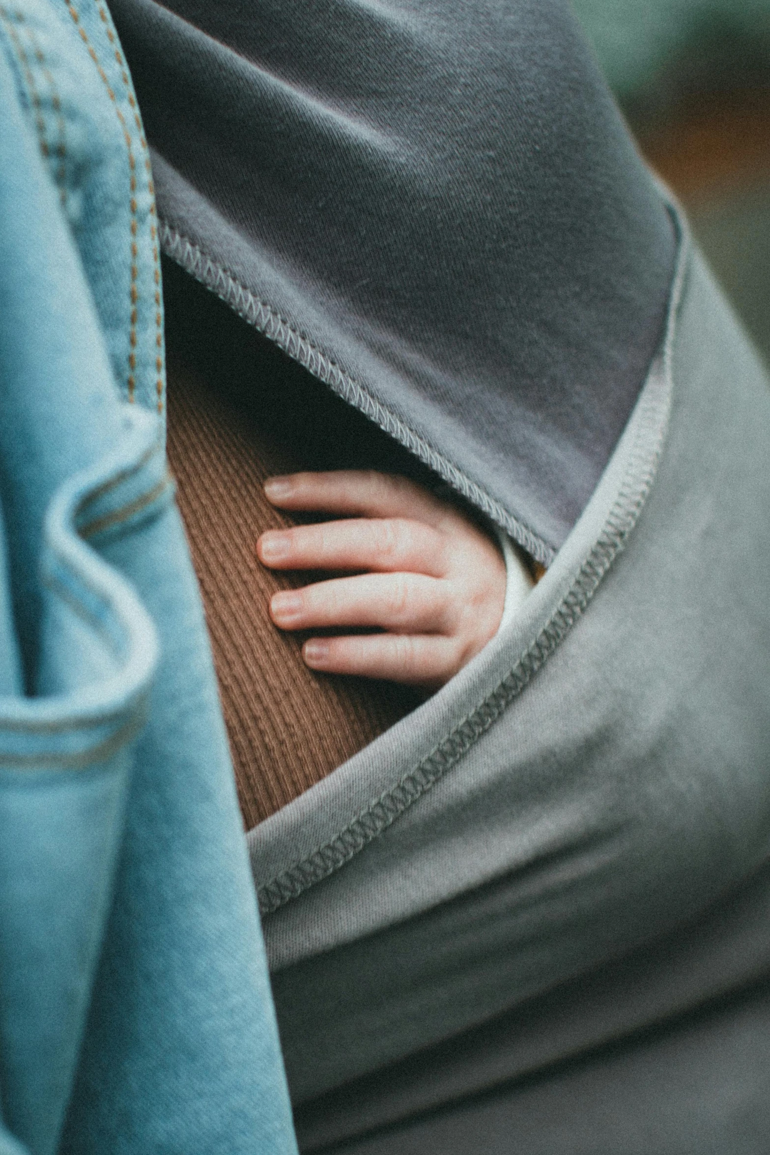 a person's torso under a jacket covered in sweat