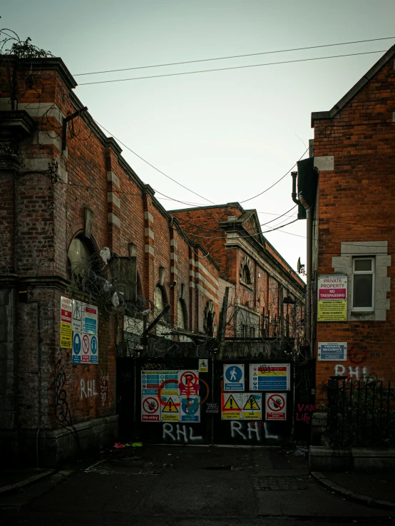 a large gate is in front of some buildings