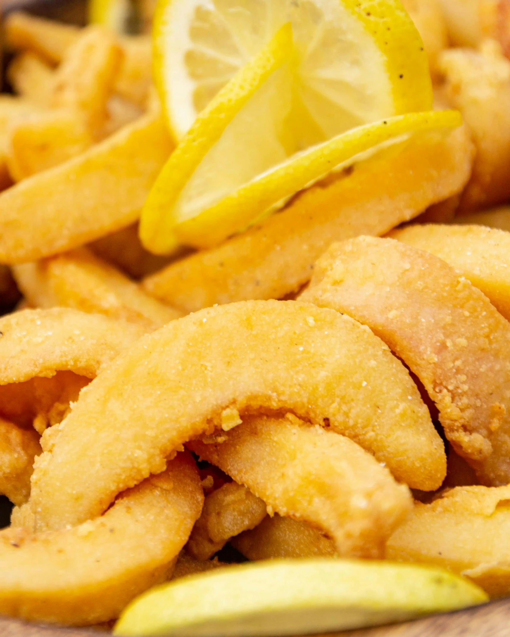 fried food with lemon and some ketchup