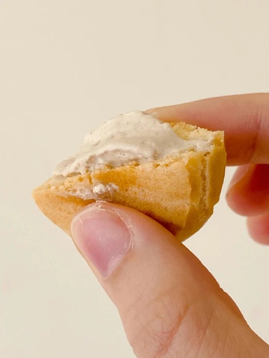 a person holding onto a bite of food