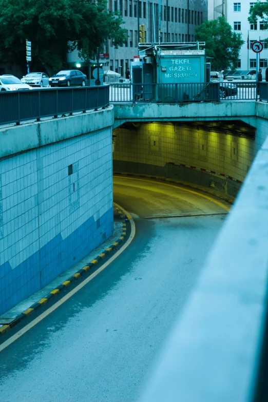 a tunnel tunnel entrance next to a street