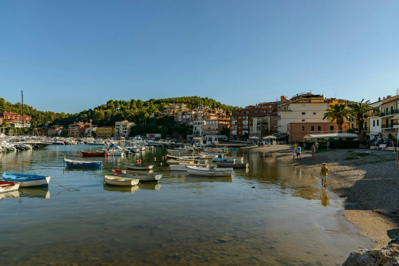 boats tied up in the harbor on an island