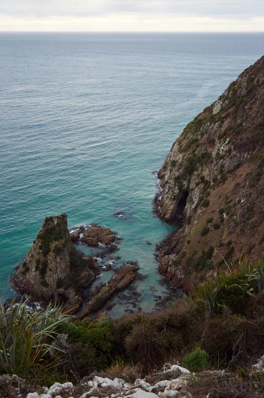 the coast of a rocky, ocean - like area near some rocks