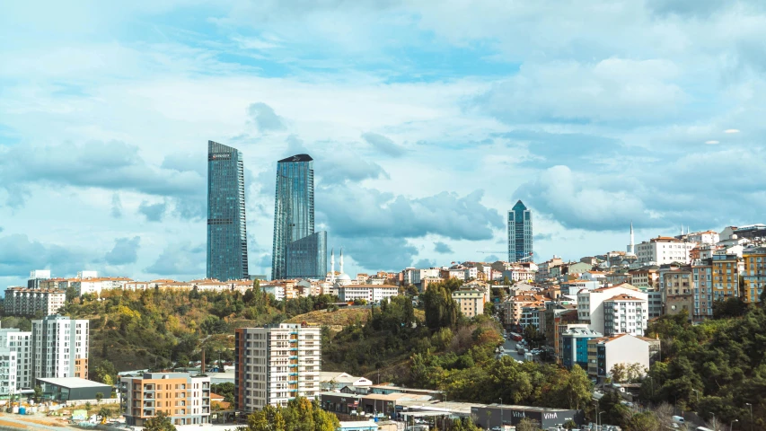 a tall city with some very large buildings near by