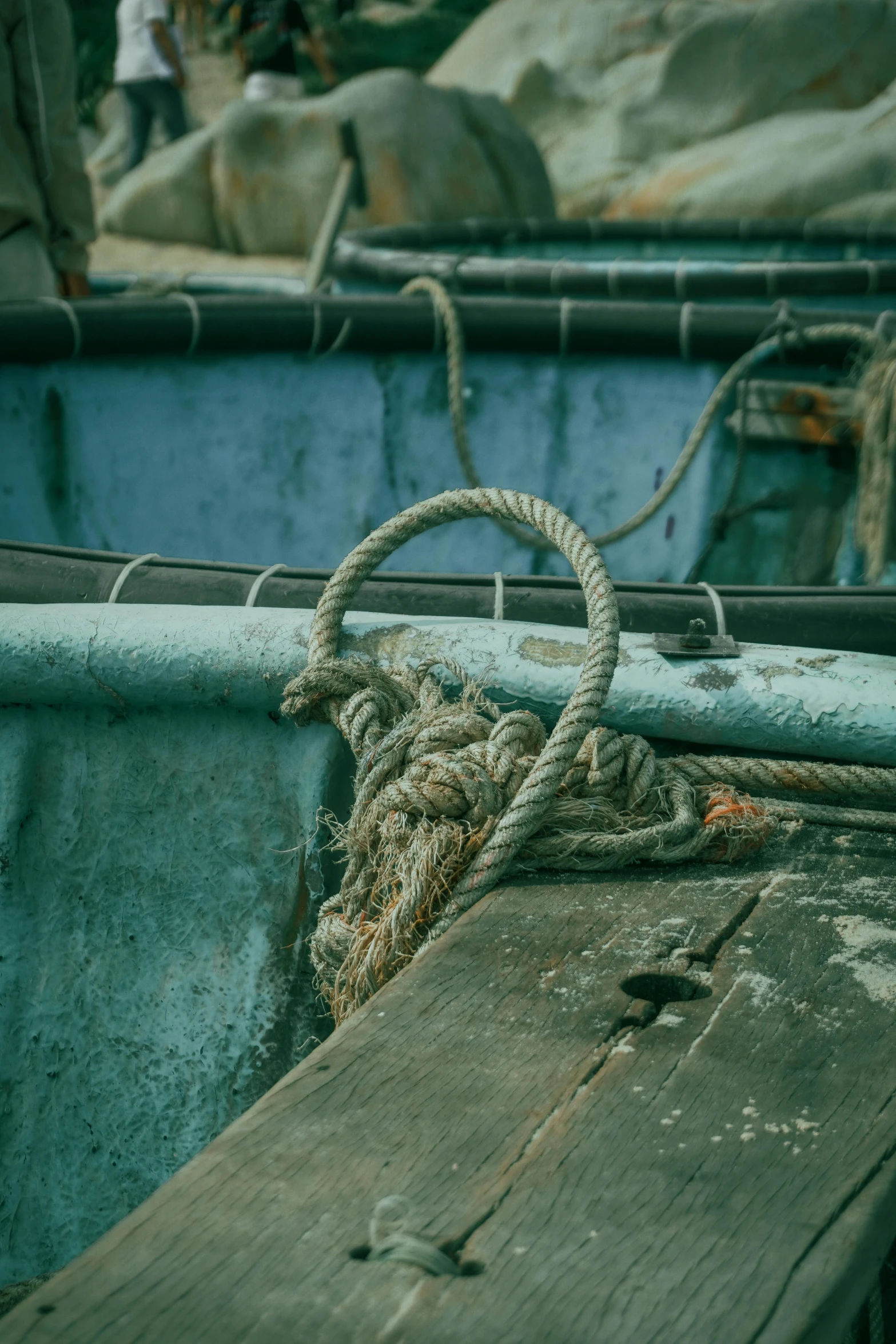 rope on top of a wooden board in a boat