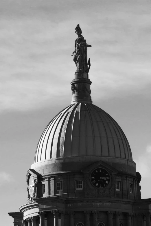 a very tall clock tower with a very large dome on it