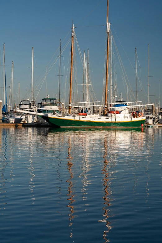 a harbor with many different colored boats parked on the water