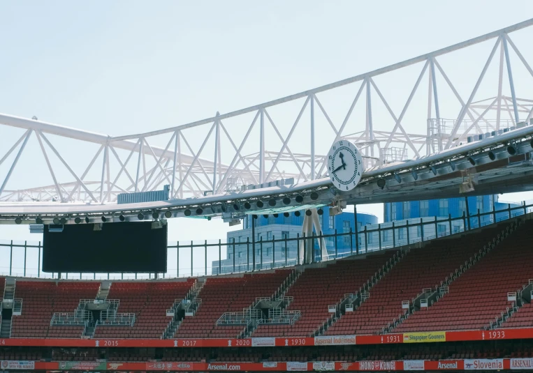 a stadium is decorated with chairs and a clock