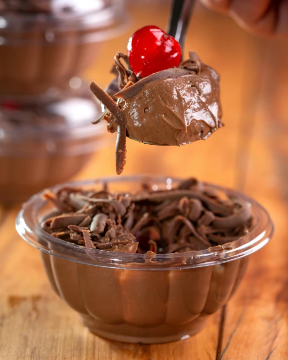 a spoon with some food on it that is in a bowl