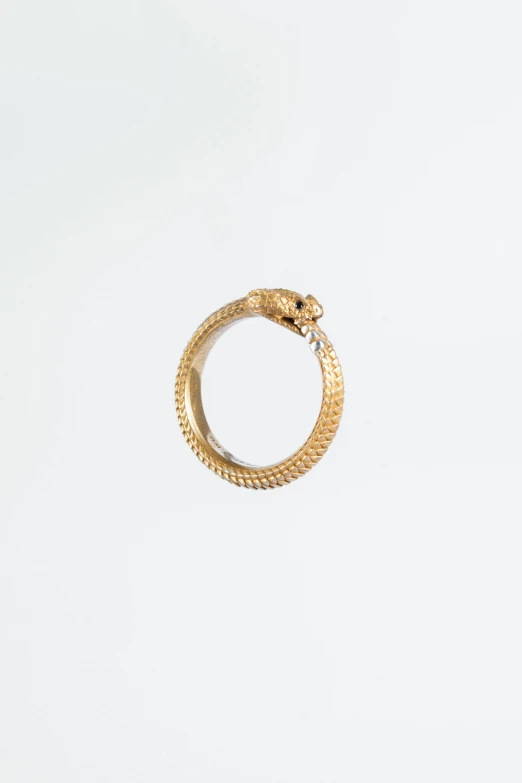 a ring sitting on top of a white table