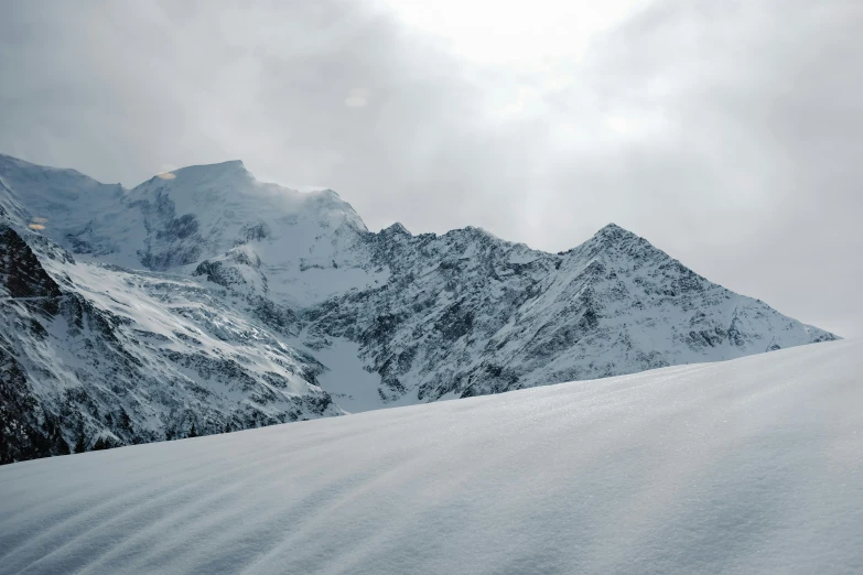 a person riding skis on top of a snowy slope