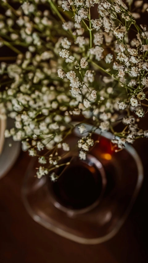 a bowl and some flowers on a table