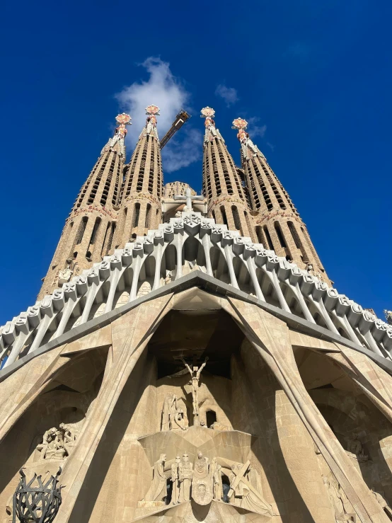 the top of a cathedral with sculptures above it