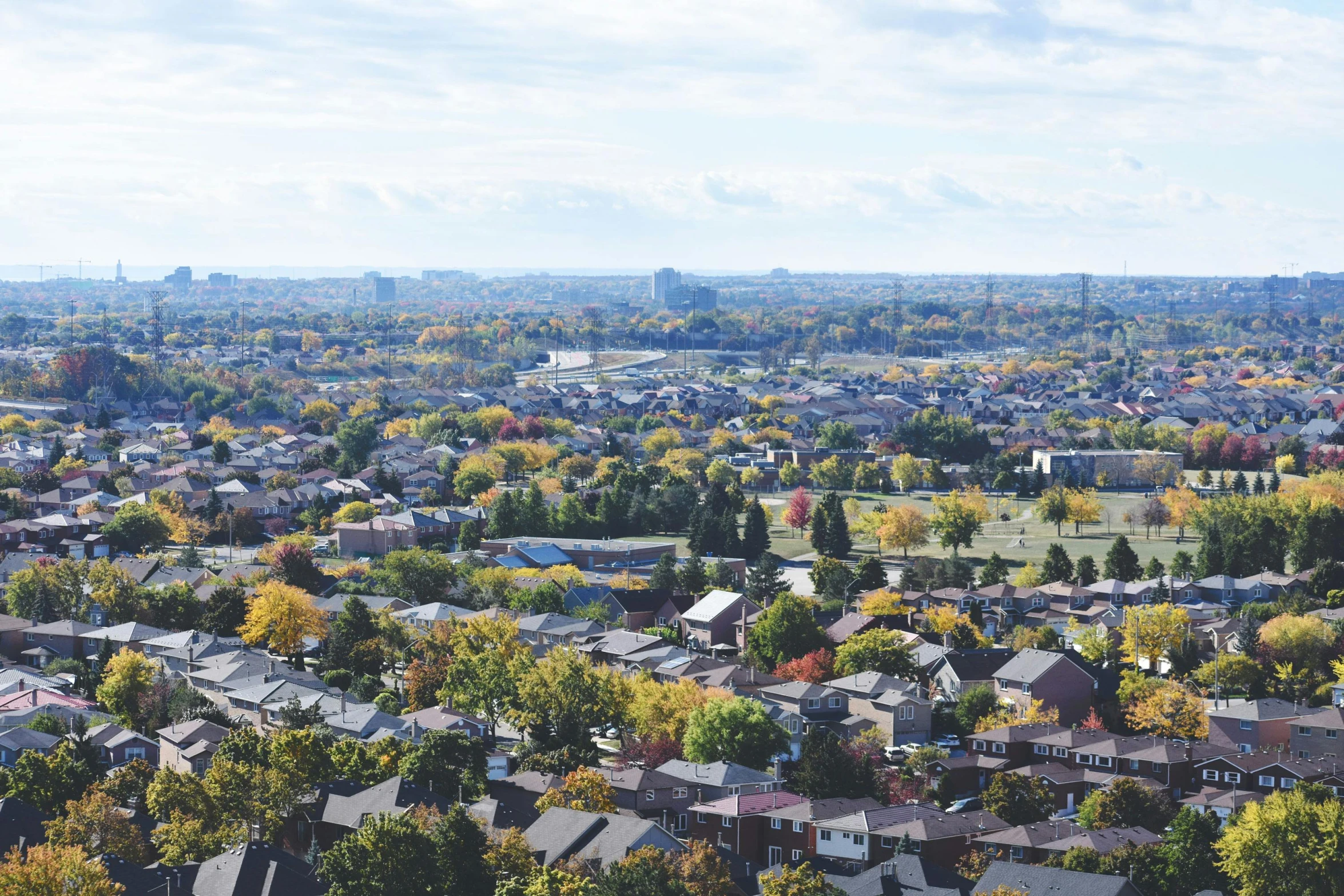 a city with lots of houses and trees