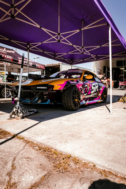 an image of a car on the ground under a tent