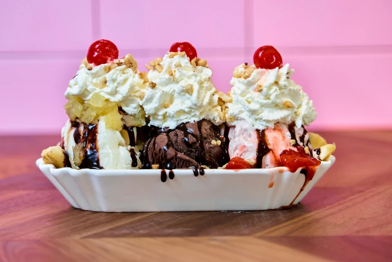 three scoops of ice cream with toppings on it