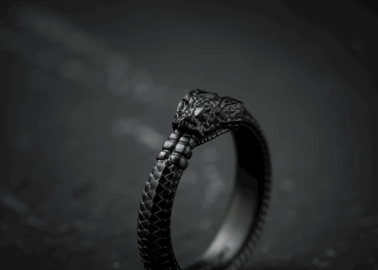 a close up s of an elegant ring that has a snake head on it